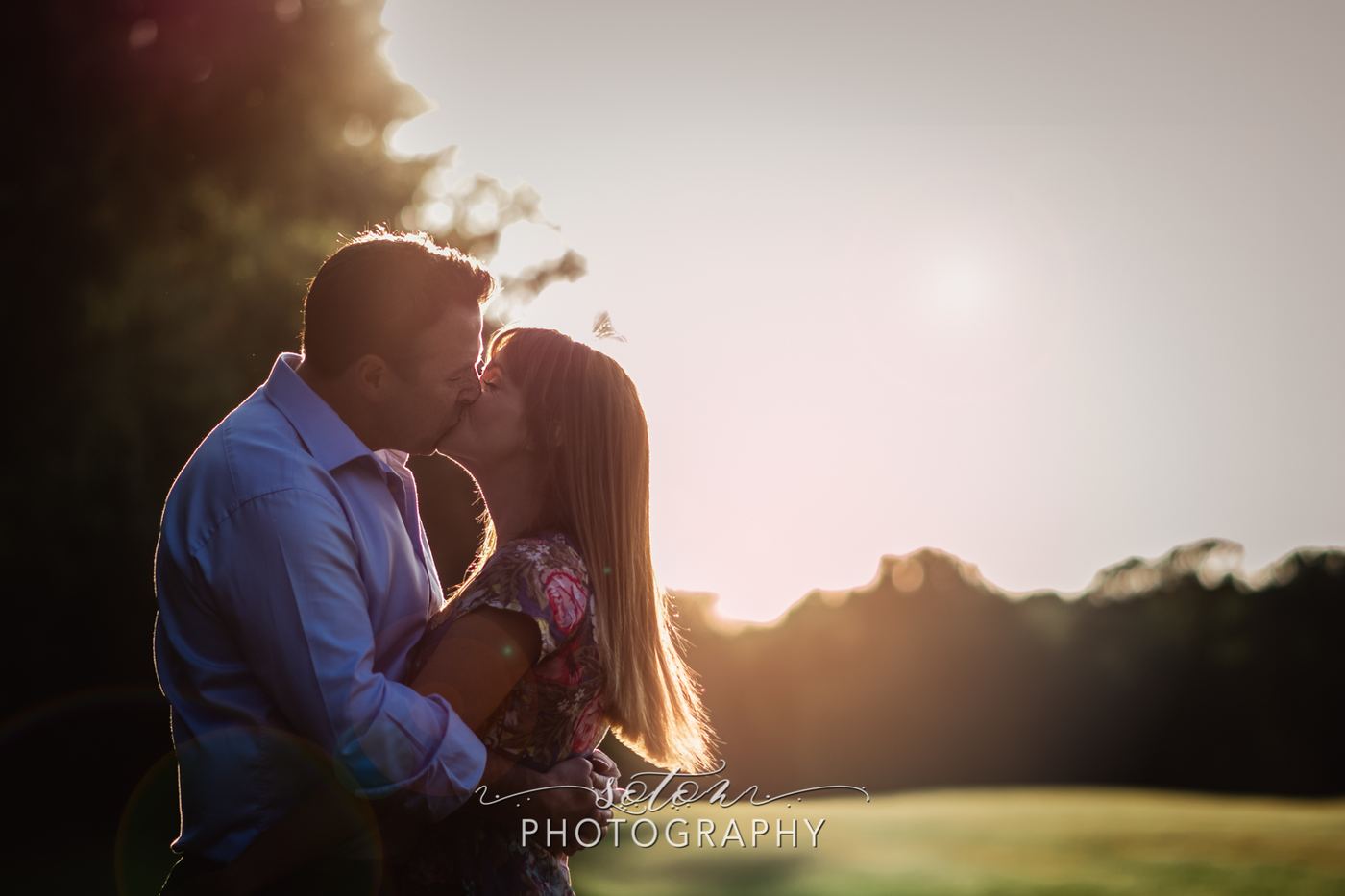Engaged couple embracing